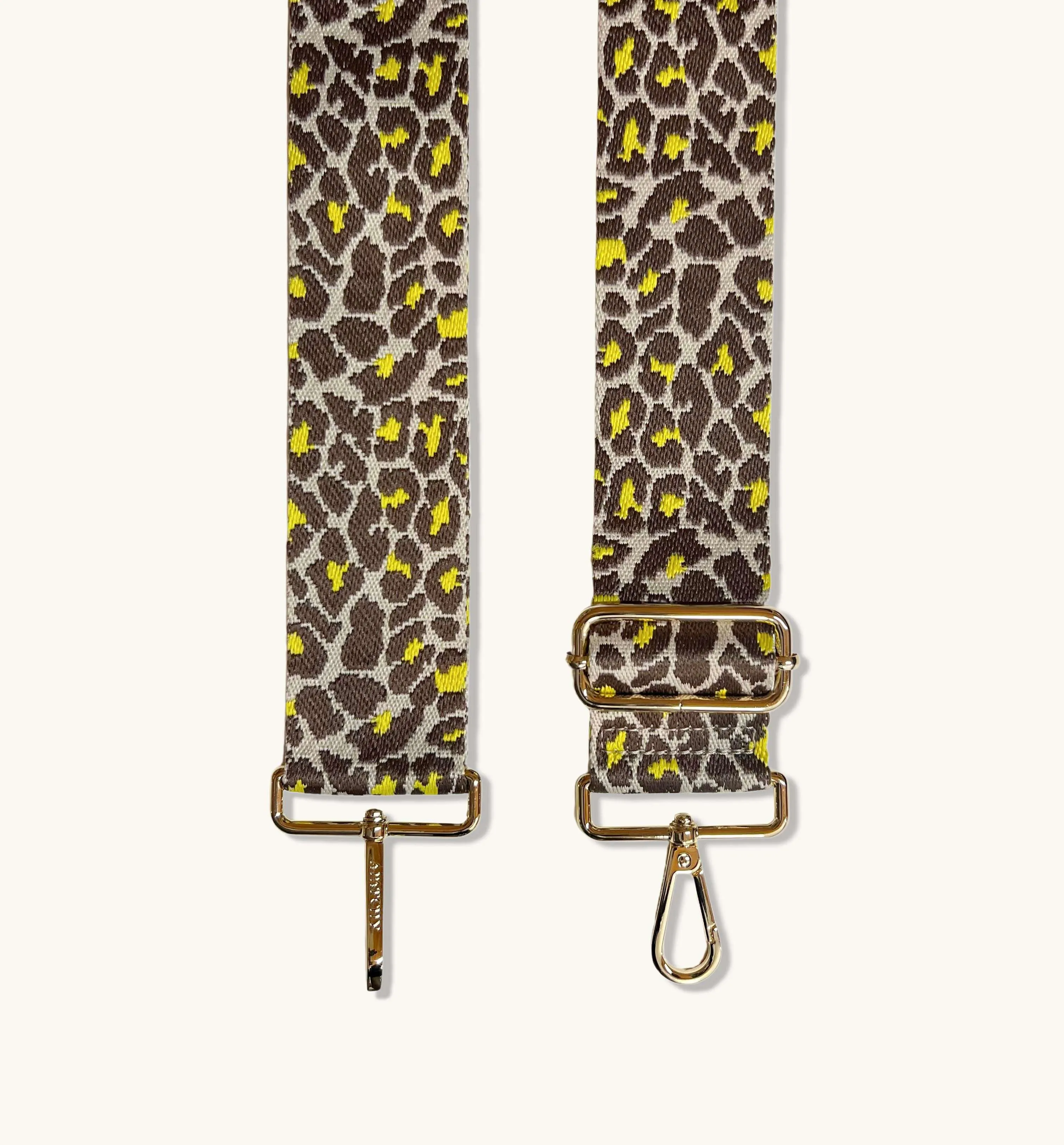 The Tassel Latte Leather Crossbody Bag With Lemon Cheetah Strap