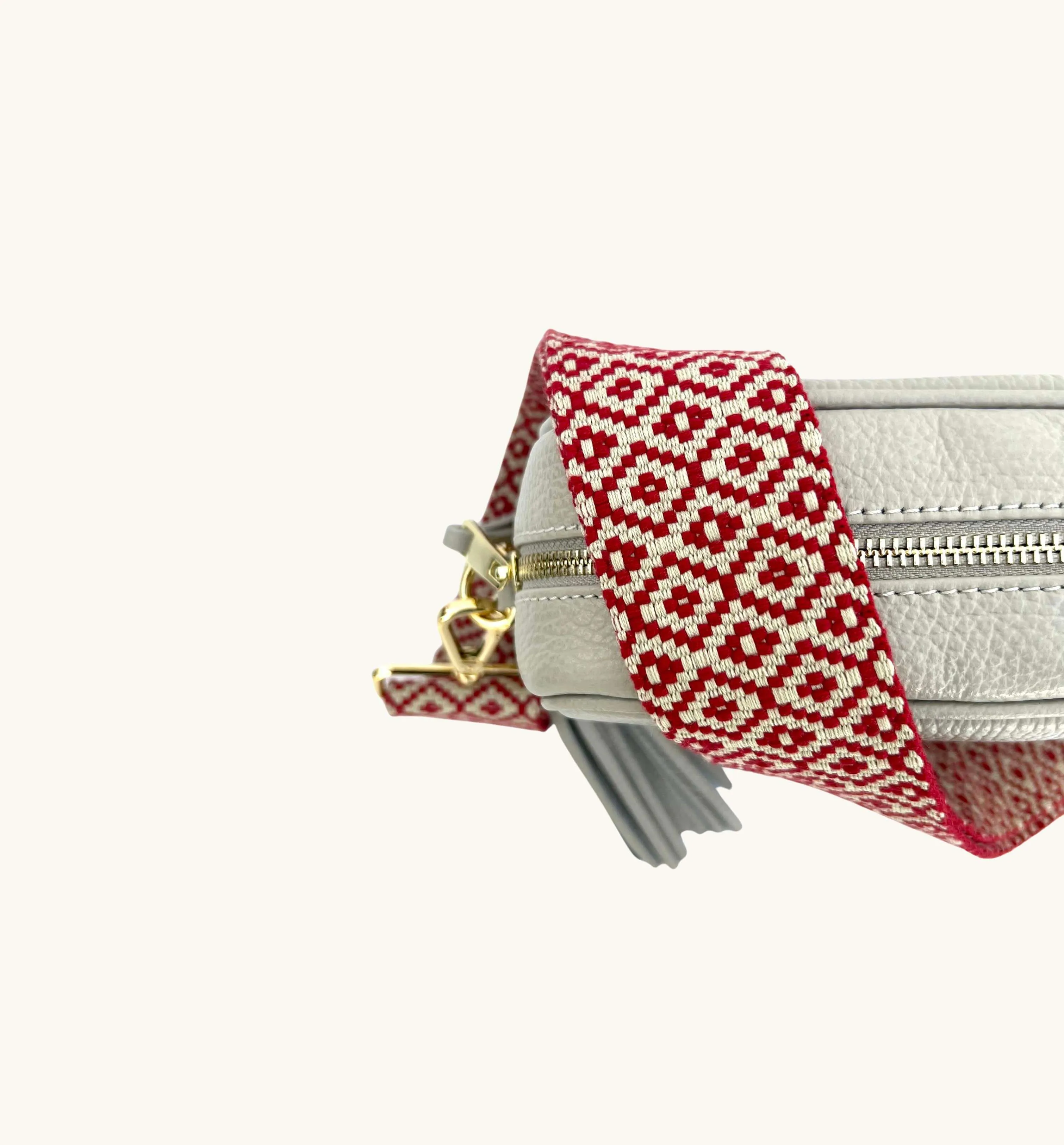 The Tassel Light Grey Leather Crossbody Bag With Red Cross-Stitch Strap