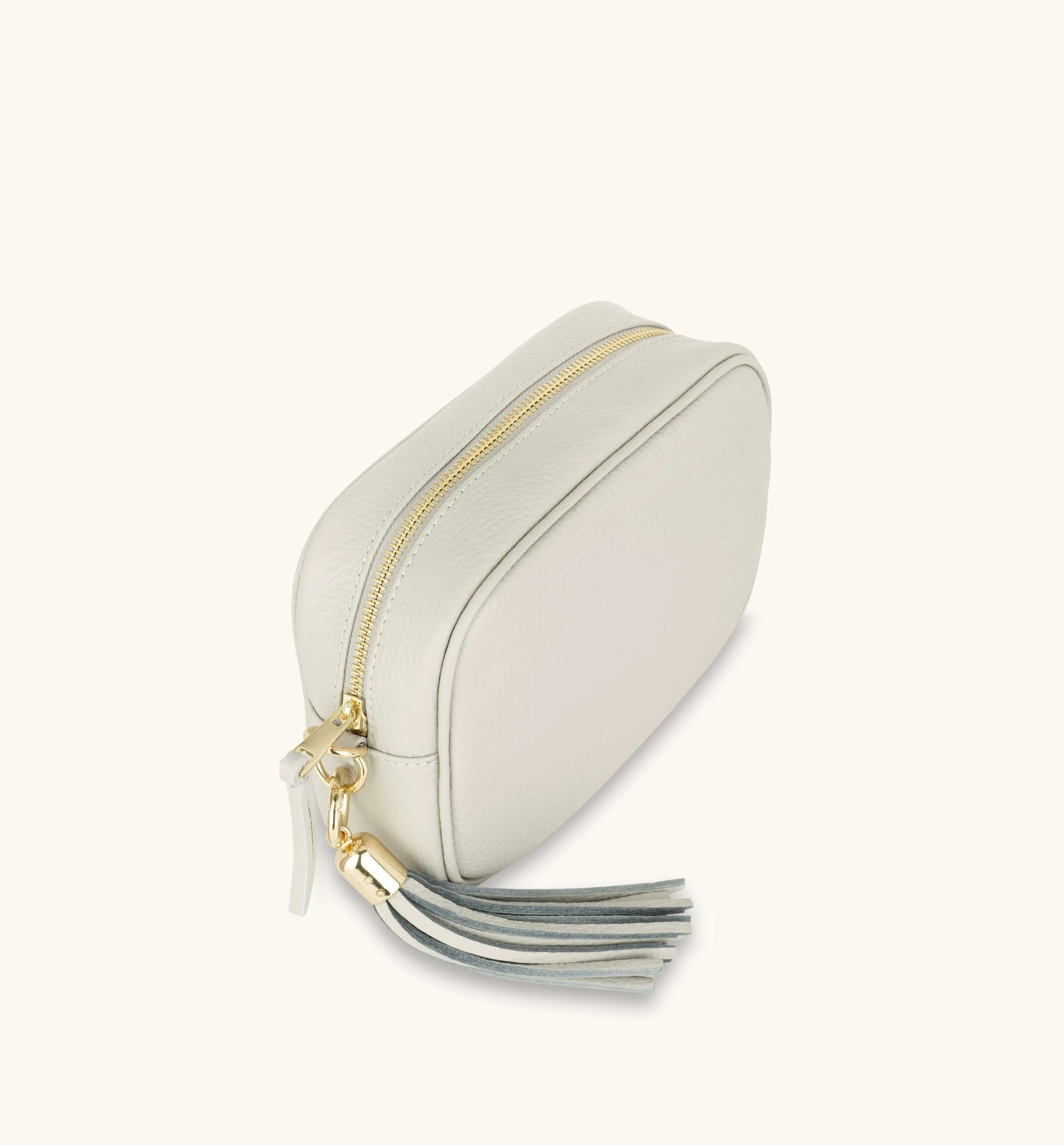 The Tassel Light Grey Leather Crossbody Bag With Red Cross-Stitch Strap