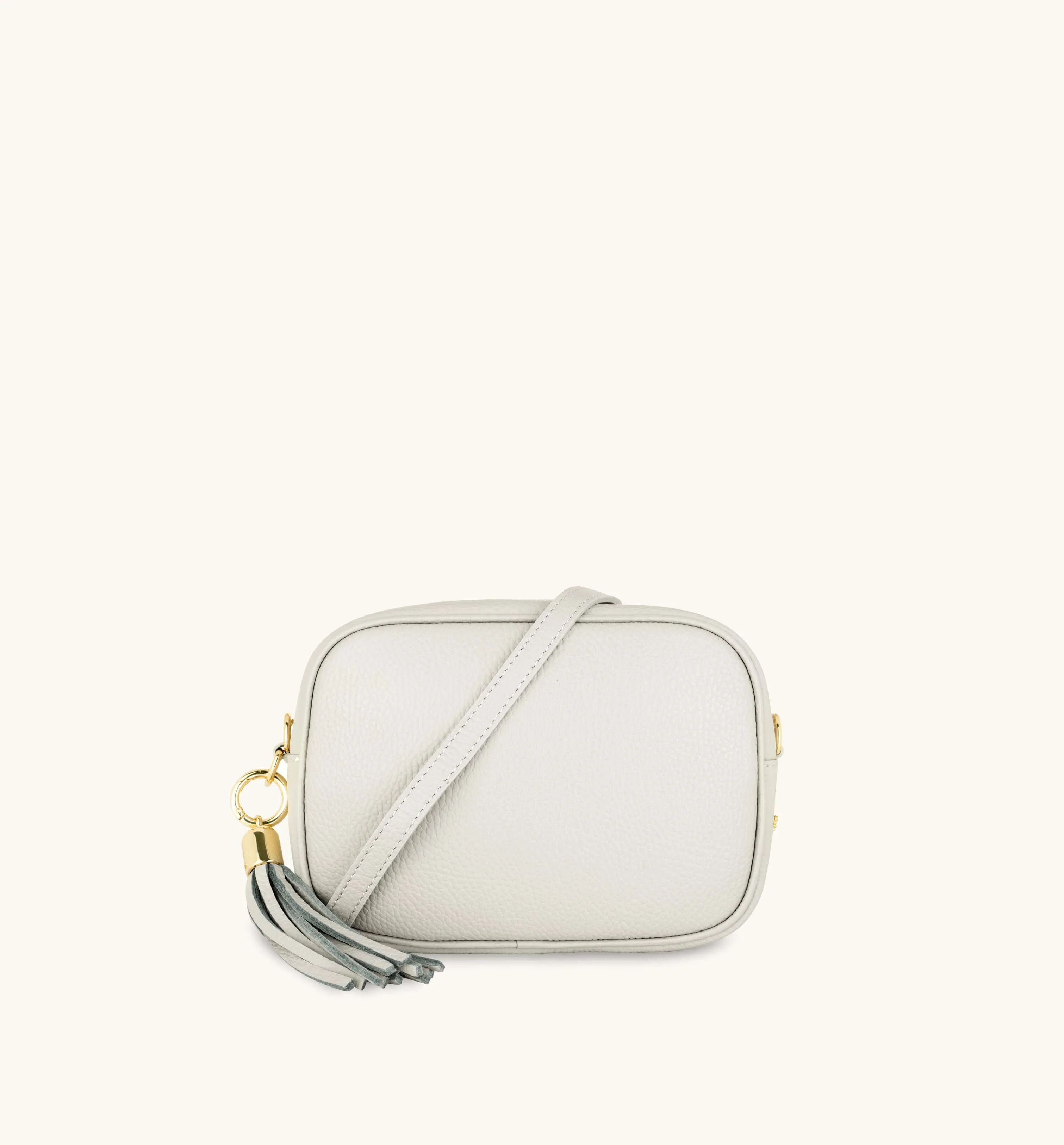 The Tassel Light Grey Leather Crossbody Bag With Red Cross-Stitch Strap